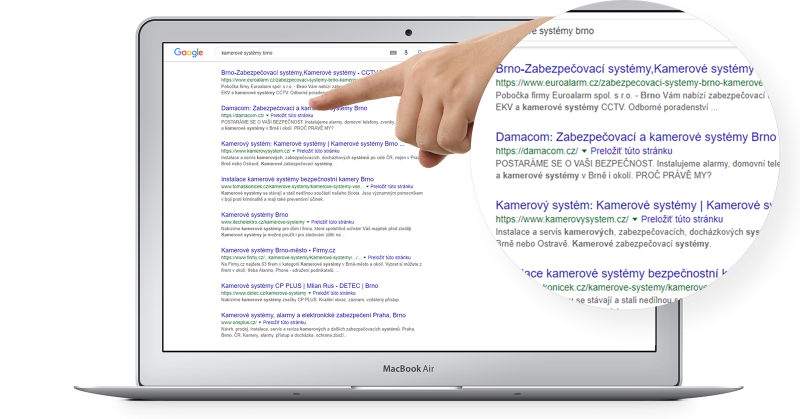 HAND POINTS TO THE MONITOR