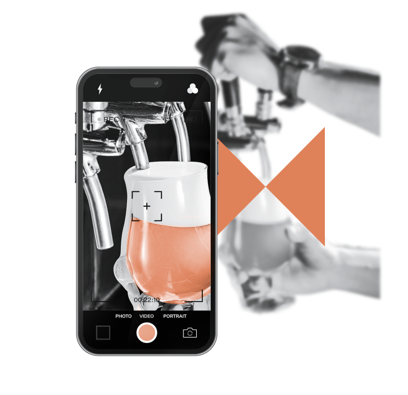 Mobile phone filming beer tapping